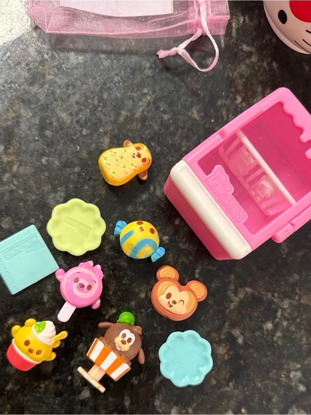 Disney 6 Munchlings with Pink Cooler case, and Multicolor Character Pieces